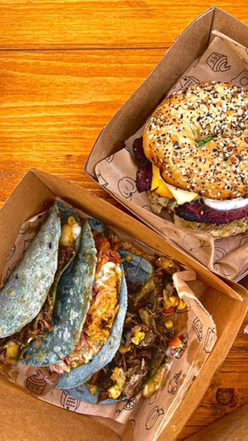 Tacos and a burger, boxed for delivery